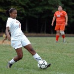 Sophomore Caramie Tshimanga skillfully dribbles the ball during the game.