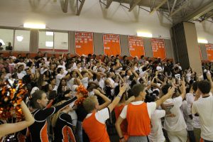 Senior students chant "freshman" and "we can't hear you" during the pep rally. 