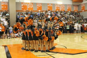 The poms team performs. 