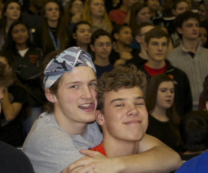 Seniors Hunter Kline and Sam Chisolm excitedly embrace each other at the Friday pep rally. 