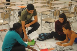 Members of the Homework Center collaborate on their schoolwork together