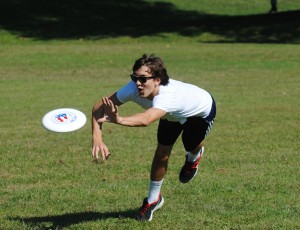 Senior Dominic Cicatelli lunges for the Frisbee during a practice.