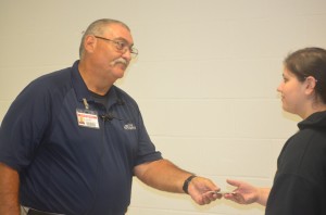 Moot Camut is the newest security guard and is the new offensive line coach. Camut and fellow security guard Kelly Martinez work to ensure the safety of students.