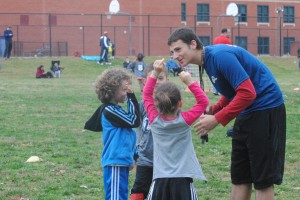 Senior Dakota Fernandez looks on as he prepares his youth soccer team for a Sunday afternoon match. Fernandez's team is a part of the i9 Montgomery County soccer league that consists of players ages five to 11 years old.