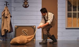 Ebenezer Saltmarsh, played by senior Luke Cooper-Martin and freshman Andrew Mijango (pictured above) drag a sack with the body of a nurse across the stage. Saltmarsh caused chaos and confusion for all the other unsuspecting characters at their stay at Ye Old Wayside Inn.