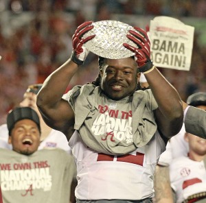 Alabama running back Eddie Lacy, the game's MVP, celebrates with the championship trophy following a 42-14 win against Notre Dame in the BCS National Championship game at Sun Life Stadium on Monday, January 7, 2013, in Miami Gardens, Florida. Courtesy of MCT Campus