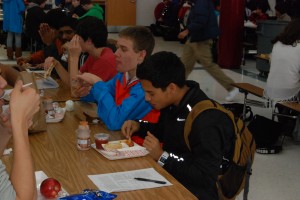 Seniors eat at lunchtime with styrofoam lunch trays, unaware of the path the trays will take when they are thrown away. --David Lopez