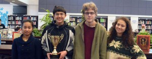Seniors Catherine Nguyen, Vibhu Someshwar, Jacob Shpiece and junior Gabrianna Andrews proudly showcase the trophy they won after defeating other Maryland high schools and winning the regional competition in January. --Adam Bensimhon