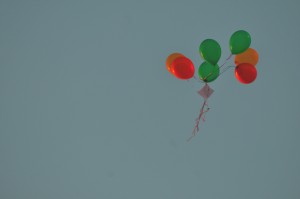 A boquet of balloons holding a note flies through the air. Several students wrote notes on the balloons as well as writing a paper note. --Sarah Huang, Yearbook