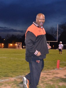 Varsity lacrosse assistant coach Lorenze Lancaster reacts to a Rockville goal during the rams 14-5 victory over Albert Einstein HS. The team is looking to surpass last year's winning season.