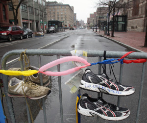 Sneakers hang on gate in memory of the Boston Marathon bombing in Boston, Massachusetts. Courtesy of MCT Campus
