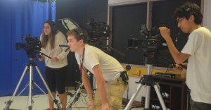 Students in Annear's second period T.V. production class start to work with cameras and anchors after practicing making news packages on a PowerPoint program for the first few weeks of school. Students in Annear's second period T.V. production class start to work with cameras and anchors after practicing making news packages on a PowerPoint program for the first few weeks of school. --Adam Bensimhon