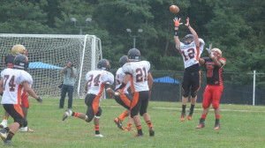 Junior safety Tim Slingluff attempts to catch an inteception, preventing the Wheaton Knights from recieving a first down. Slinguff alongisde the rest of the Rams defense only allowed the Knights to score one touchdown in the entire second half on Sept. 28. --Adam Bensimhon