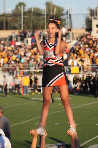 Sophomore Dani Sobel excites the crowd as she is lifted in the air at the Richard Montgomery football game during an exciting Rams win. --Kaylee Davis