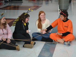 From left: Ellie Hambrecht, Jessica Hetchkop, Haley Oa��Brien and Julie Ramos play a web game during the Match party Oct. 28. Buddies were paired through a personality survey.