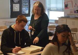 College test prep teacher Anne Ehlers assists senior Doug Trach with SAT practice questions. The course helps prepare students for all sections of the SAT: critical reading, math and writing. College test prep teacher Anne Ehlers assists senior Doug Trach with SAT practice questions. The course helps prepare students for all sections of the SAT: critical reading, math and writing. --Adam Bensimhon