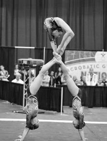 Kirschner climbs on her partners as the trio perfoms a ring handstand at the 2012 acrobatic gymnastics nationals in Detroit. Kirschner climbs on her partners as the trio perfoms a ring handstand at the 2012 acrobatic gymnastics nationals in Detroit. Courtesy of Champion League