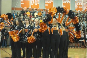 The poms squad impresses the crowd by performing a circular 