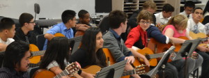 Guitar students prepare their instruments for the concert. The students played together along with some individual performers such as freshman Riordan Caisse playing "Hey There Delilah." --Elissa Britt