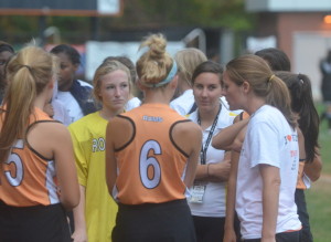 Coach Ulmer talks with field hockey team during a game in the fall season. Ulmer is the head coach for both the field hockey and girls lacrosse teams. --Adam Bensimhon