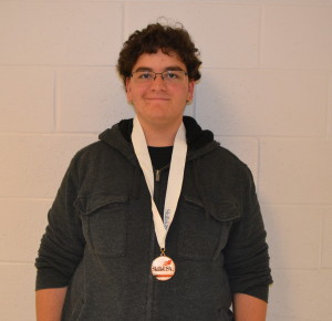 Junior Loren Hersh poses with his first place medal in computer maintainance. Junior Loren Hersh poses with his first place medal in computer maintainance. --Claudia Mirembe