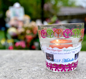 A memorial candle is placed near the gravesite of former senior Michelle Miller, who was killed in a murder-suicide last April. Miller's friends and classmates came together to remember her April 8. --Camila Torres