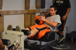 Senior Kellen Cremins takes advantage of open gym time to prepare for basketball tryouts. Cremins played varsity last year, assisting the team in their 2014 Division 3A title. --Mercy Fosah