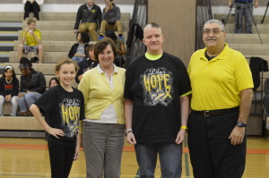 Security Team Leader Albert Camut and his family pose with Lily Weaver in support of the Lily's Hope Foundation. -Claudia Mirembe