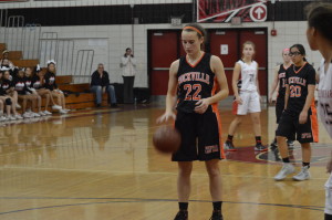 Senior captain Kathleen McTighe prepares for a free throw against Quince Orchard HS. The Lady Rams lost 45-39, making only nine of 20 free throws. Weaver now emphasizes practicing free throws because it will help win games. --Claudia Mirembe