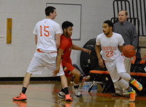 Senior Kellen Cremins sets a pick for senior Rakeem Hoy-Farria as he dribbles for a layup. --Meklit Bekele