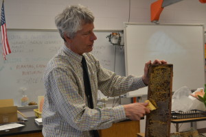 Gregg Gochnour shows his horticulture class a beehive. Students later extracted honey from the beehives with Gochnour's assistance and were allowed to eat it. --Camila Torres