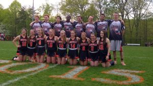 The seniors on both the boys varsity lacrosse and girls varsity lacrosse teams pose for Senior Night. The event to honor the seniors happened between the two games. Courtesy of Noelia Torres