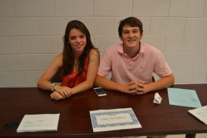 Seniors Mark Pankowski and Joanna Klinedinst pose for a photo as they run the NHS tutoring table.