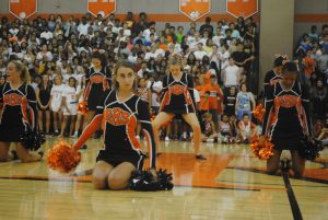 The Poms team prepare to perform. 