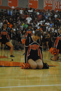 Senior Poms captain, Samantha Dellenoci prepares to perform during the pep rally. 