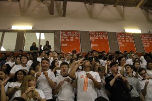 The senior section excitedly cheer on various fall sports teams. 