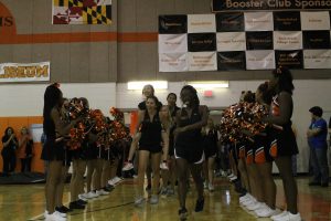 Lady Rams varsity tennis team enter the gym at the start of the pep rally. 