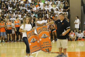 Junior Alexa Stewart accepts banners for swimming. 