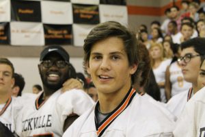 Senior Erik Blautzik smiles for the camera during the pep rally.