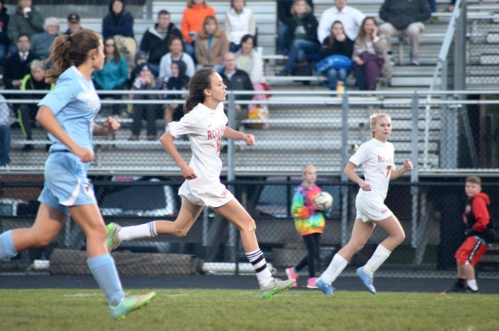 Senior Anna Weiler chases after the ball.