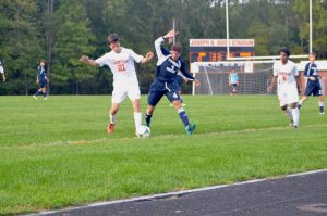 Garcia-O'Donnell fights against a Magruder player for the ball.