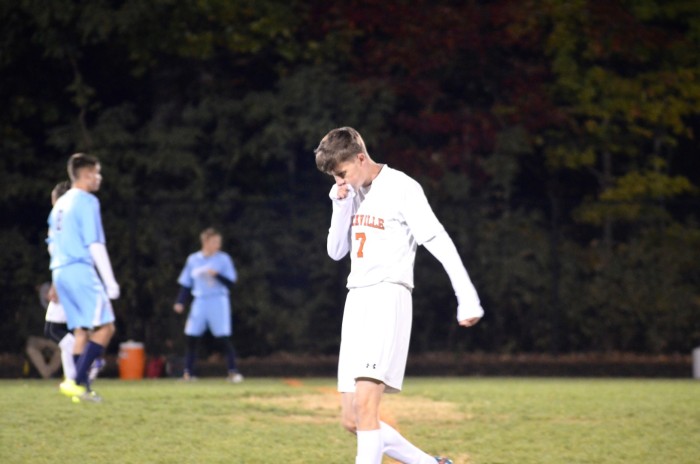 Senior Robin Clarke walks across the field during the boys game.