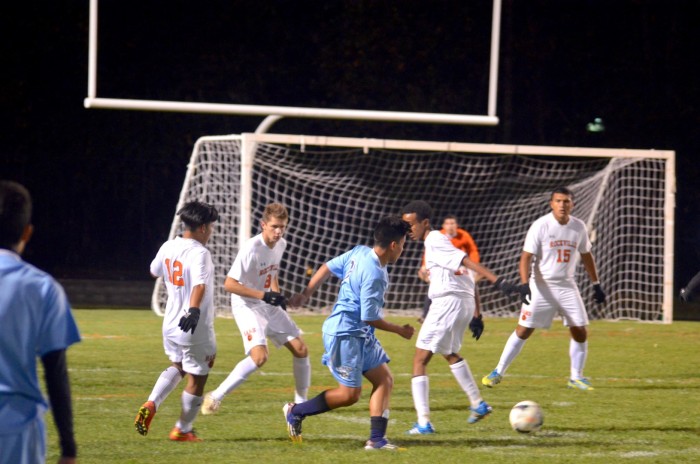 Players from Rockville and Clarksburg struggle to take control of the ball.