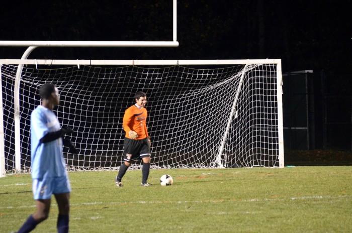 Beatres prepares to kick the ball away from the goal.