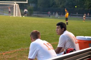 Junior Thomas Da Silva and Senior Diego Mendoza worriedly watch the game.