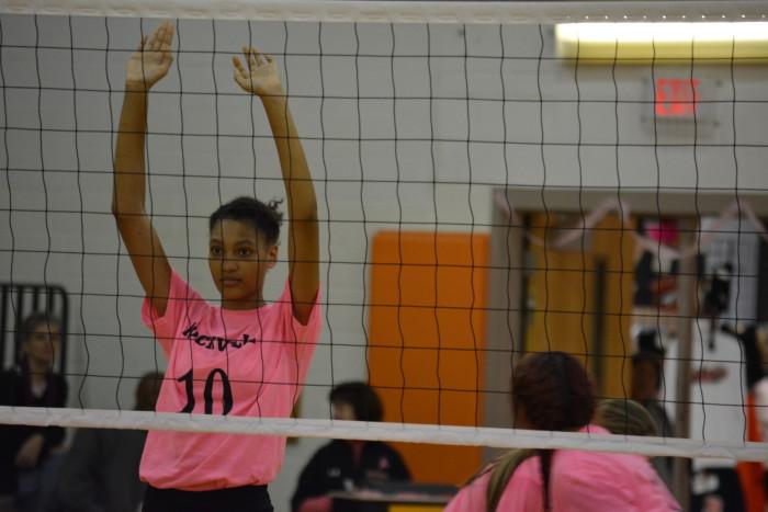 Junior Jaylah James stands at the net to defend against Walter Johnson. 