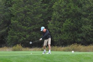 Freshman Ryan Kelly tees off to start the tournament.