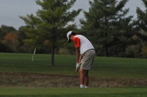 Freshman Cole Kirchner attempts to lob the ball onto the greens.