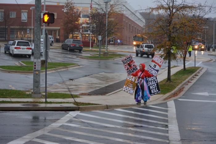 A member of Westboro Baptist Church protests in front of RHS.