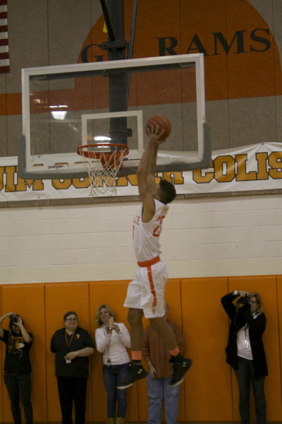 Senior Essex Thompson excites the crowd with his dunking skills. 